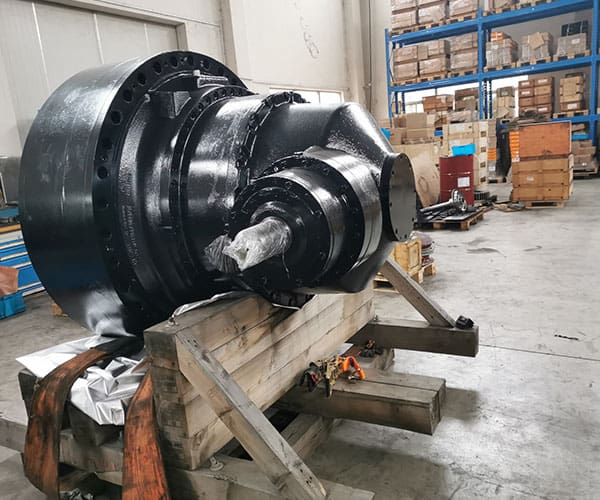 A large black metal object sitting on top of a wooden table.