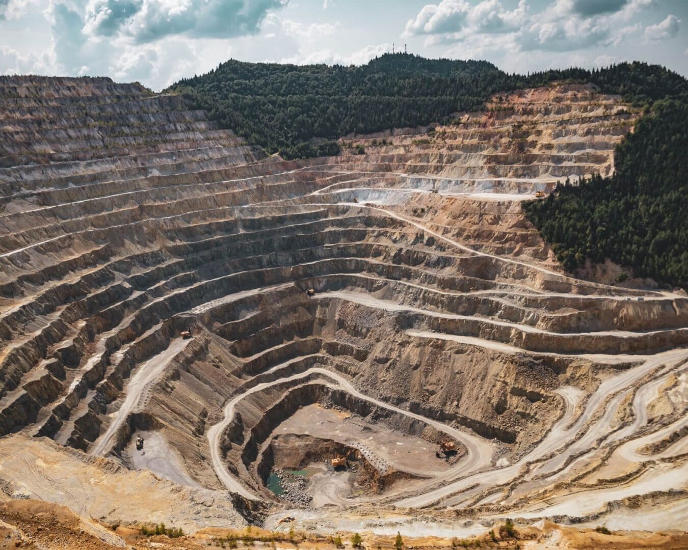 A large open pit with many levels of rock.